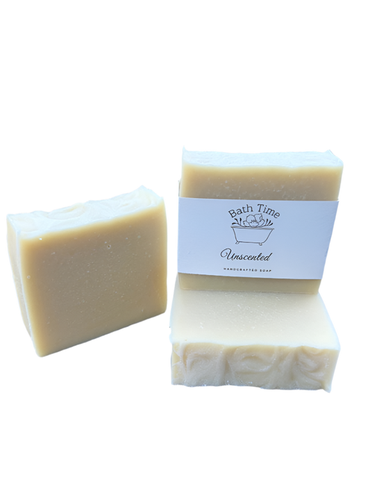 Two bars of unscented soap with a packaging label on a white background