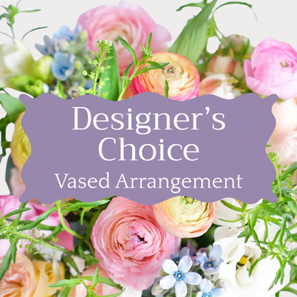 Floral arrangement with a 'Designer's Choice Vased Arrangement' label.