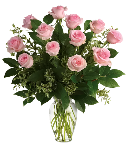 Bouquet of pink roses in a clear vase on a white background