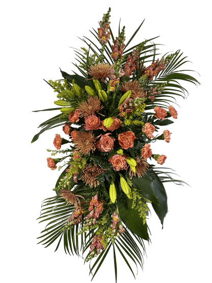 Standing spray with peach, copper, and yellow colored flowers