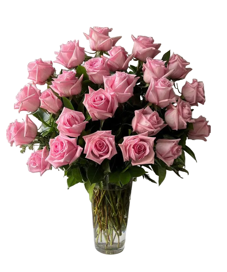 Bouquet of three dozen  pink roses in a clear vase with greenery