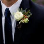 Ranunculus and thistle boutonniere